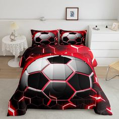 a soccer ball bed set with red and black colors