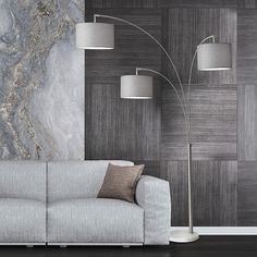 a modern living room with marble wallpaper and floor lamp