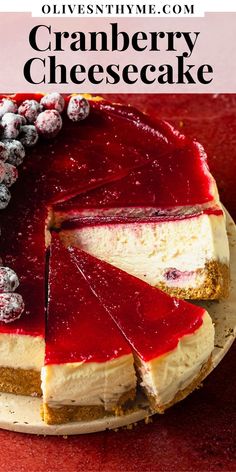 a cheesecake with cranberry sauce is cut into slices and served on a plate