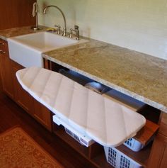 an image of a kitchen with a sink and dishwasher on the appliance