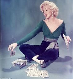 a woman sitting on the ground with money in front of her and a quote about how to