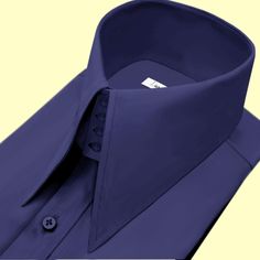 High Long Pointed Collar Tailor-Made On Order shirt 𝘈 𝘸𝘩𝘪𝘵𝘦 𝘩𝘪𝘨𝘩-𝘤𝘰𝘭𝘭𝘢𝘳 𝘴𝘩𝘪𝘳𝘵 𝘪𝘴 𝘢 𝘤𝘭𝘢𝘴𝘴𝘪𝘤 𝘢𝘯𝘥 𝘵𝘪𝘮𝘦𝘭𝘦𝘴𝘴 𝘸𝘢𝘳𝘥𝘳𝘰𝘣𝘦 𝘴𝘵𝘢𝘱𝘭𝘦 𝘵𝘩𝘢𝘵 𝘦𝘹𝘶𝘥𝘦𝘴 𝘴𝘰𝘱𝘩𝘪𝘴𝘵𝘪𝘤𝘢𝘵𝘪𝘰𝘯 𝘢𝘯𝘥 𝘦𝘭𝘦𝘨𝘢𝘯𝘤𝘦. 𝘛𝘩𝘪𝘴 𝘵𝘺𝘱𝘦 𝘰𝘧 𝘴𝘩𝘪𝘳𝘵 𝘧𝘦𝘢𝘵𝘶𝘳𝘦𝘴 𝘢 𝘤𝘰𝘭𝘭𝘢𝘳 𝘵𝘩𝘢𝘵 𝘴𝘵𝘢𝘯𝘥𝘴 𝘶𝘱 𝘢𝘯𝘥 𝘦𝘯𝘤𝘪𝘳𝘤𝘭𝘦𝘴 𝘵𝘩𝘦 𝘯𝘦𝘤𝘬, 𝘱𝘳𝘰𝘷𝘪𝘥𝘪𝘯𝘨 𝘢 𝘳𝘦𝘧𝘪𝘯𝘦𝘥 𝘢𝘯𝘥 𝘱𝘰𝘭𝘪𝘴𝘩𝘦𝘥 𝘭𝘰𝘰𝘬. 𝘛𝘩𝘦 𝘤𝘳𝘪𝘴𝘱 𝘸𝘩𝘪𝘵𝘦 𝘤𝘰𝘭𝘰𝘳 𝘰𝘧 𝘵𝘩𝘦 𝘴𝘩𝘪𝘳𝘵 𝘪𝘴 𝘷𝘦𝘳𝘴𝘢𝘵𝘪𝘭𝘦 𝘢𝘯𝘥 𝘱𝘢𝘪𝘳𝘴 𝘸𝘦𝘭𝘭 𝘸𝘪𝘵𝘩 𝘢 𝘷𝘢𝘳𝘪𝘦𝘵𝘺 𝘰𝘧 𝘴𝘵𝘺𝘭𝘦𝘴 𝘢𝘯𝘥 𝘤𝘰𝘭𝘰𝘳𝘴, 𝘮𝘢𝘬𝘪𝘯𝘨 𝘪𝘵 𝘢𝘯 𝘪𝘥𝘦𝘢𝘭 𝘤𝘩𝘰𝘪𝘤𝘦 𝘧𝘰𝘳 𝘣𝘰𝘵𝘩 𝘧𝘰𝘳𝘮𝘢𝘭 𝘢𝘯𝘥 𝘤𝘢𝘴𝘶𝘢𝘭 𝘰𝘤𝘤𝘢𝘴𝘪𝘰𝘯𝘴. 𝘛𝘩𝘦 𝘴𝘩𝘪𝘳𝘵 𝘪𝘴 𝘵𝘺𝘱𝘪𝘤𝘢𝘭𝘭𝘺 𝘮 Classic Navy Slim Fit Shirt, Navy Classic Slim Fit Shirt, Fitted Navy Shirt For Office, Solid Color Fitted Shirt With Fold Down Collar, Navy Fitted Office Shirt, Fitted Solid Shirt With Fold Down Collar, Elegant Navy Office Shirt, Classic Navy Business Tops, Classic Fitted Navy Dress Shirt