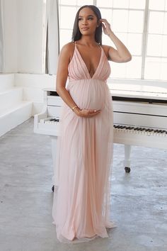 Paige is sleek and classy with her lace pleated bust detail and her sheer train. She dreamy and will have you and your bump on the best bump list. The Paige Fully-lined, and super lightweight fabric with a soft stretchy waistband, for yours and your baby’s comfort. Available in 3 colours: Pink, Blue, Paige Model is 32 weeks, wearing a small. Pink Baby Shower Dress, Maternity Occasion Wear, Pink Maternity Gown, Tulle Baby Shower, Babyshower Dress, Vestidos Para Baby Shower, Baby Shower Outfit For Guest, Lace Maternity Gown, Baby Shower Gown