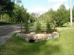 there is a rock tunnel in the grass