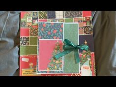 a christmas card with a green bow on it and many other cards in the background