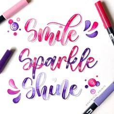 the words smile sparkle smile are painted in pink and purple