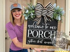 a woman holding up a sign that says the laundry room wash dry fold repeatt