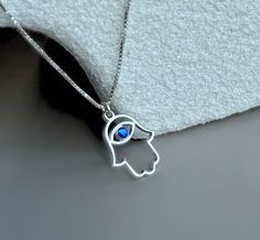 * This Hamsa Necklace includes a 0.7 thickness of Hamsa evil eye pendant hanging on a Box chain, both are made from 925 sterling silver and available in 24k gold plated over solid silver. this unique piece of evil eye jewelry with a Hamsa pendant makes it a perfect gift for the woman in your life. This Silver Hamsa Necklace is a one-of-a-kind handmade necklace for Hanukkah, a gift for a birthday, or any occasion. SIZE & MATERIALS * ITEM TYPE: Hamsa Evil Eye Necklace  * MATERIALS: 925 Sterling Silver, 24K Gold Plated * PENDANT SIZE: 14.3mm -16mm * THICKNESS: 0.7mm * CHAIN STYLE: Box Chain * CHAIN LENGTH OPTIONS: 14-22in  - How to order  :  Please provide your chain length. - Personal design service:  Please send me a private message for custom designs, and I'll do my best to fulfill your re Hanukkah Gift Pendant Jewelry, Sterling Silver Jewelry For Hanukkah Gifts, Spiritual Jewelry For Hanukkah Gift, Hamsa Evil Eye, Message Bracelet, Hamsa Pendant, Hamsa Necklace, Fancy Gifts, Personalized Pendant