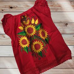 Handmade Embroidered Mexican Sunflower Blouse - Size Medium Large Handmade in Chiapas, Mexico Material: Manta (Natural Cotton) Size Medium Measurements (approximate): Length: 23 inches Armpit to Armpit: 19 inches Size Large Measurements (approximate): Length: 25 inches Armpit to Armpit: 21 inches Size: XL Measurements (approximate): Length: 24 inches Armpit to Armpit: 24 Care Instructions: We recommend hand washing in cold water with like colors & air drying. A warm iron can be used if needed. Our blouses are handmade and may have slight imperfections that make them unique & one of a kind. Please check out the photos & feel free to send us a message if you have any questions. Summer Festival Floral Embroidered Fabric, Bohemian Floral Embroidered Fabric For Summer, Spring Cotton Blouse With Motif, Summer Embroidered Top With Motif, Bohemian Cotton Tops With Machine Embroidery, Cotton Peasant Top With Floral Embroidery For Beach, Spring Folk Tops With Machine Embroidery, Spring Folk Style Tops With Machine Embroidery, Folk Style Spring Tops With Machine Embroidery