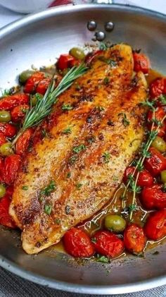 chicken with tomatoes and olives in a pan