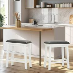 two stools are sitting at the kitchen table