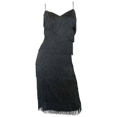 Fabulous mid 1970s does 1920s LILLI DIAMOND black fully fringed flapper style jersey cocktail dress! Words cannot even begin to describe how utterly gorgeous and flattering this dress is in person! Layers and layers of fringe look fantastic with movement (especially on the dance floor). Soft jersey stretches to fit. Hidden zipper up the back with hook-and-eye closure. Extremely well made, with a heavy amount of attention to detail. The perfect little black dress that exudes class, all the while 1950s Cocktail Dress, Chic Maxi Dresses, Satin Cocktail Dress, Disco Dress, Perfect Little Black Dress, Flapper Style, Studio 54, Vintage Maxi Dress, Gowns With Sleeves