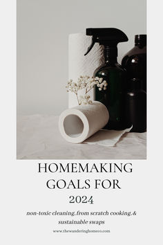 some bottles and paper towels on top of a white table with the words homemaking goals for