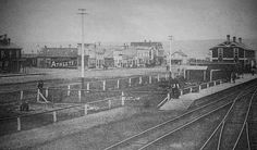 an old black and white photo of train tracks