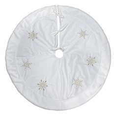 a white round cushion with snowflakes on it