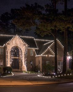 a house covered in christmas lights at night