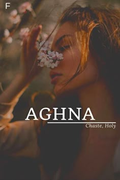 a woman with flowers in her hair and the words aghna above her head