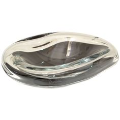 an oval shaped glass dish on a white background