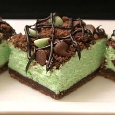 there is a piece of cake with green frosting and chocolate toppings on it