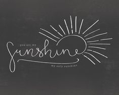 the words you are my sunshine written in chalk on a blackboard with sunbursts