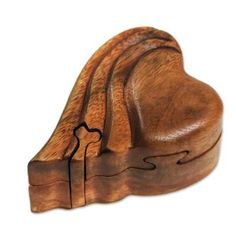 a heart shaped wooden box with two handles