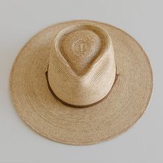 DESCRIPTION Crafted with exotic Guatemalan Palm Straw and hand shaped in Texas, USA, the Monterrico is a sturdy, toasted colored straw hat shaped into a teardrop fedora crown and wide, flat brim that offers amazing sun protection. Trimmed with a brown, genuine leather chinstrap and leather slider, the Monterrico is the perfect summer companion, and is built to stick with you for years to come. UPF Rating: 50 + (Excellent) HAT SIZE CHART Available in 55 S, 57 M, 59 L, 61 XL and 63 XXL. Due to the Mens Sun Hats, Hat Size Chart, Hand Shapes, Sun Protection, Straw Hat, Perfect Summer, Hat Sizes, Easy Wear, Sun Hats