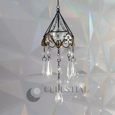 a chandelier hanging from the ceiling in front of a white background with crystal drops