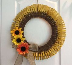 a sunflower wreath hanging on the front door