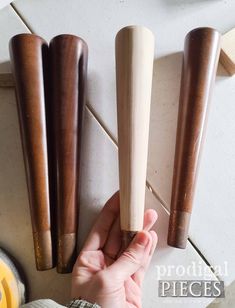 a person is working on some wooden objects