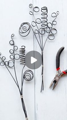 scissors and wire on a white wooden surface with text overlay that reads how to make wire flowers