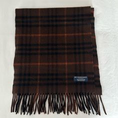 Nwot, Authentic, Perfect Condition 100% Incredibly Soft Cashmere, Fringed Burberry Scarf. Tones Of Brown, Black And Nutmeg. Totally Unisex. Measures Approx 54”L (Without Fringe) X 12” W. Burberry Inspired Scarf, Burbery Scarf, Burberry Vintage Scarf, Luxury Plaid Wool Scarves, Burberry Scarves & Shawls, Burberry Scarf, Burberry Accessories, London Outfit, Brown Plaid