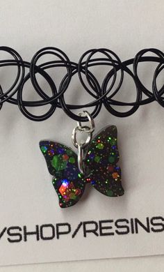 Black Holographic Butterfly Choker 90s Elastic Tattoo - Etsy Adjustable Black Fantasy Choker, Handmade Fantasy Choker For Gifts, Handmade Fantasy Choker As Gift, Black Fairy Grunge Jewelry For Gift, Black Fairy Grunge Jewelry Gift, Fairy Grunge Black Jewelry Gift, Black Rave Jewelry Gift, Black Rave Jewelry For Gifts, Black Rave Jewelry For Gift