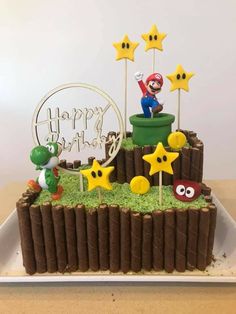 a cake made to look like it is in the shape of a mario bros game