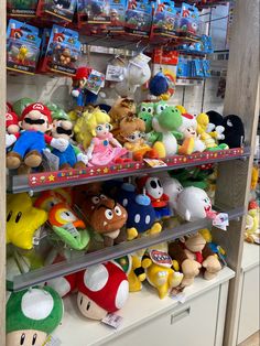 a shelf filled with lots of stuffed toys