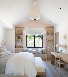 a bedroom with a bed, desk and window in it's centerpieces