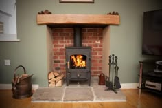 a wood burning stove sitting inside of a living room