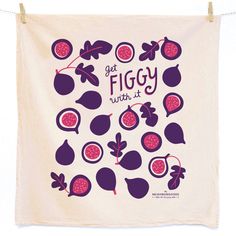 a towel hanging on a clothes line that says get figgy with it surrounded by pomegranates and leaves