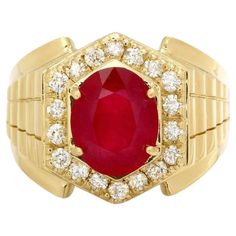 a gold ring with a large red stone surrounded by small white and clear stones on the sides