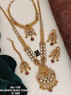 Description :- Antique Gold Plated Indian Jewelry Set, Indian Choker, Ruby Choker Necklace Set, Guttapusalu Necklace, Temple Jewelry, South Indian Jewelry Gift yourself a royal look with this perfectly crafted kundan necklace set from Manalisstudio. Crafted with high quality kundan stones and pearls, it is impressive in design. The green enamel artwork adds perfect texture to the design. Perfect for weddings and festivities, this antique necklace set should be put on with your favorite sari or l Aad Jewellery Design, Kundan Jewellery Set Necklaces, Antik Jewellery Gold, South Indian Gold Necklace Designs, Ruby Choker Necklace, Ruby Choker, Guttapusalu Necklace, Indian Gold Necklace Designs, Indian Jewelry Set