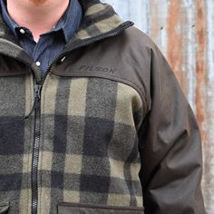 The Filson Mackinaw Wool Hunting Jacket is a heavy-duty jacket made of 100% Mackinaw Wool, providing ultimate warmth and durability. Featuring an oil finish Cover Cloth hood, sleeve, and shoulder overlays, it offers extra protection against the elements. The adjustable hood, hem, and cuffs allow for a perfect fit, while the fleece-lined pockets keep your hands warm and comfortable. With a rear map/game pocket lined with coated nylon and an internal zipper for zip-in liners, this jacket is perfec Fall Fleece Jacket With Double-lined Hood For Outdoor, Fall Outdoor Fleece Jacket With Double-lined Hood, Fall Outdoor Sport Coat With Fleece Lining, Outdoor Fall Sport Coat With Fleece Lining, Fleece-lined Outerwear For Outdoor Work In Fall, Fall Sport Coat With Fleece Lining For Outdoor Activities, Winter Waterproof Hunting Outerwear, Winter Hunting Waterproof Outerwear, Waterproof Hunting Outerwear For Winter