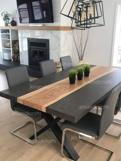 a dining room table and chairs in front of a fireplace