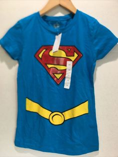 Youth Halloween SUPERGIRL Tee Shirt Size L (12/14) DC Comics New Red Superhero T-shirt With Short Sleeves, Dc Shirts Dc Comics, Red Superhero Short Sleeve T-shirt, Superhero Graphic T-shirt With Short Sleeves, Superhero Fan Merchandise Cotton T-shirt, Supergirl, Tee Shirt, Dc Comics, Mens Graphic