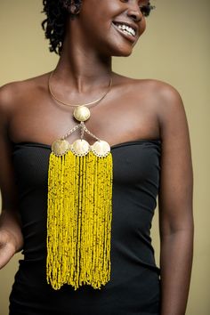 Unique African Maasai Handcrafted Beaded Necklace with an Elegant Look and Brilliant Finish. Color = Yellow and Copper. Length (Around Neck) = 16 Inches / 41 cm. Length ( Downwards ) = 15 Inches / 39 cm. **GET FREE SHIPPING FOR ADDITIONAL ITEMS PURCHASED. Yes, Buy Multiple Items and pay shipping for 1 item only- The rest ships Free. (No Limits on the number of Multiple items). With a faster delivery time of 3 days via DHLExpress, Worldwide. Ordinary/Standard Shipping also available upon request. African Jewelry Gold, Yellow Round Beads Choker For Festivals, Yellow Beaded Choker Necklace For Festivals, Yellow Choker With Round Beads For Festivals, Yellow Festival Choker With Round Beads, Yellow Beaded Chain Necklace For Festivals, Yellow Beaded Bib Necklaces With Round Beads, Traditional Yellow Jewelry, Yellow Polished Beads For Festivals