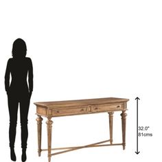 a woman standing next to a table with two drawers on each side and one drawer at the top