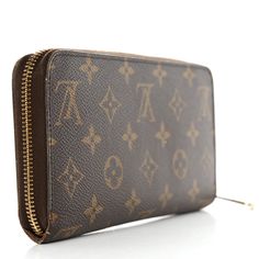 This is an authentic LOUIS VUITTON Monogram Zippy Wallet. This wallet is crafted of classic Louis Vuitton monogram coated canvas. The brass wrap-around zipper opens the wallet to a brown cross-grain leather interior with card slots, a zipper compartment, and patch pockets. Louis Vuitton Wallet, Wallet Accessories, Leather Interior, Authentic Louis Vuitton, Louis Vuitton Monogram, Patch Pocket, Card Slots, Slots, Dust Bag