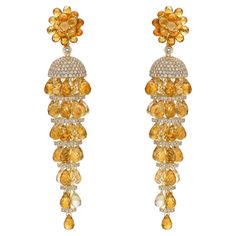 Chandelier of briolettes... unique and elegant dangling earrings that are fun to wear. Available in various colours, the briolette cuts bring out a vibrance in the gemstones that are given touches of detail with diamond accents. The pop of color with a trendy design makes these an eye-catching pair of earrings. Citrine Briolette Earrings with Diamond in 18 Karat Yellow Gold Citrine C: 33.055 carats, 6x4 & 5x3mm size, briolette drop shape. Citrine E: 27.511 carats, 6x4 & 5x3mm size, briolette dro Luxury Citrine Earrings For Wedding, Luxury Yellow Jewelry For Festivals, Luxury Yellow Gold Earrings With Gemstone Accents, Luxury Gold Briolette Chandelier Earrings, Luxury Briolette Chandelier Earrings Gift, Luxury Citrine Wedding Earrings, Luxury Briolette Earrings For Wedding, Luxury Handmade Briolette Earrings, Luxury Unique Yellow Earrings