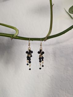 Make a statement with natural black tourmaline gemstones in this fairytale chain dangle earring design.  These bold yet feminine earrings give strong, confident vibes while offering the wearer protection against negative energies. The chains will move with every turn of your head, allowing the faceted stones to catch the light perfectly, elevating your look and your mood with every wear. The stainless steel earring wires ensure a hypoallergenic, comfortable, and wearable experience for even those with sensitive ears. Natural gemstones are believed to have special energetic and healing properties that are different for each stone and stone combination. If that hippie stuff is not for you... well, the colors are just stunning! Snag this one of a kind pair today. Black Dainty Metal Jewelry, Dainty Black Metal Jewelry, Black Dainty Jewelry For Party, Black Metal Dangle Chandelier Earrings, Elegant Black Beaded Chandelier Earrings, Elegant Black Long Drop Chandelier Earrings, Black Dangle Jewelry With Adjustable Chain, Black Long Drop Earrings With Dangling Beads, Elegant Black Earrings With Adjustable Chain