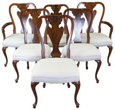 six antique dining chairs with white upholstered seats