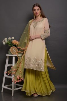 Light peach kurta with floral hand embroidered motifs. Paired with embroidered sharara and embroidered scallop dupatta.
Component: 3
Embroidered
Neckine: Boat
Sleeve Length: Three quarter
Fabric: Georgette, Net
Color: Peach
Kasab work
Embroidered dupatta - Aza Fashions Scallop Dupatta, Embroidered Sharara, Kurta Set For Women, Embroidered Motifs, Embroidered Dupatta, Light Peach, Kurta Set, Set For Women, Aza Fashion