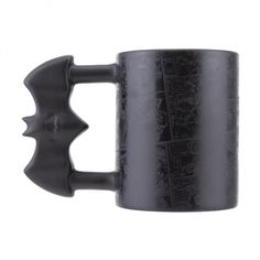 a black coffee mug with an image of bats on the inside and outside of it